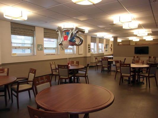 Bright interior common area with tables and decorations