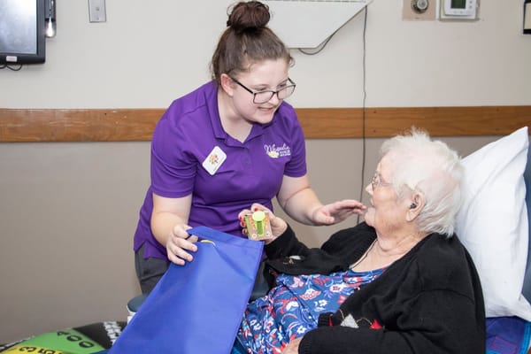 Staff member engaging with an elderly resident
