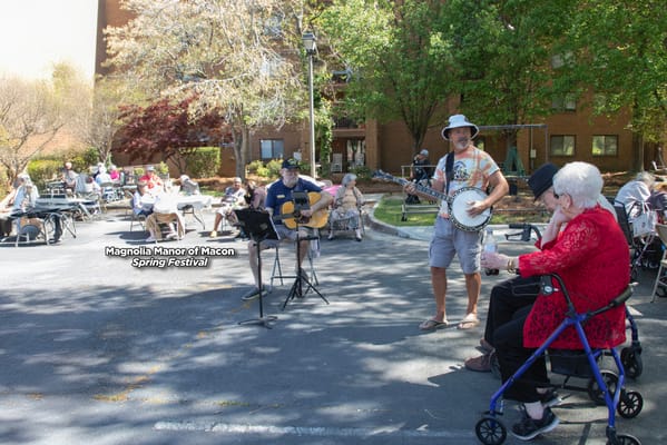 Residents enjoying music at an outdoor spring festival
