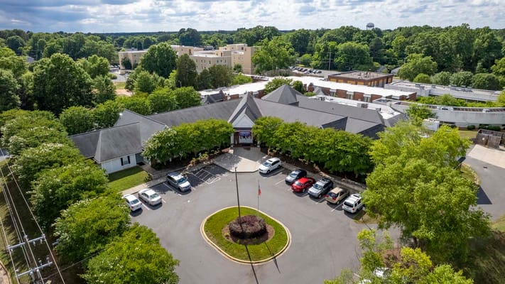 Aerial view of Rock Hill Post Acute Care Center with surrounding greenery