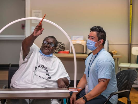 Resident and staff engaging in a recreational activity