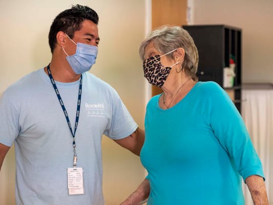 Staff member interacting with a resident indoors