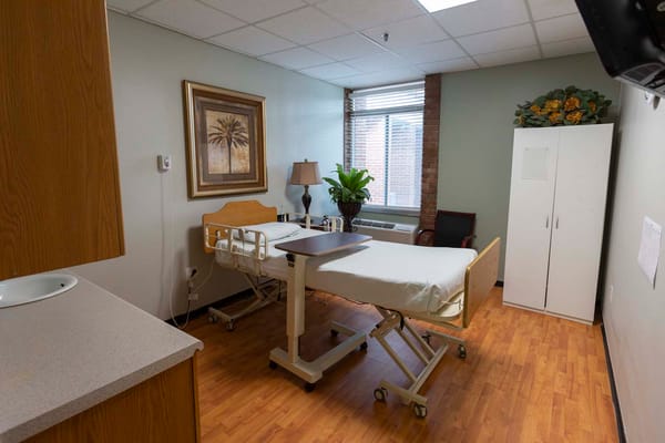 Private resident room with bed and furnishings
