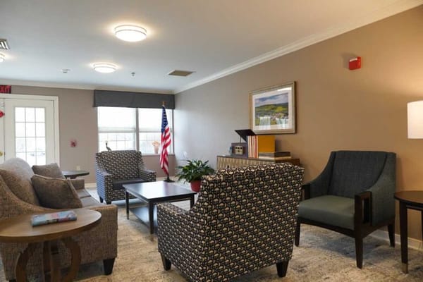 Cozy lounge area with seating and American flag