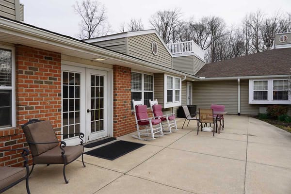 Outdoor seating area with rockers and tables