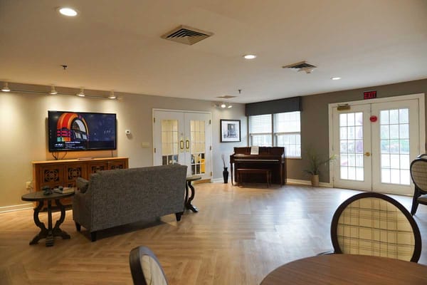 Interior common area with seating and a piano