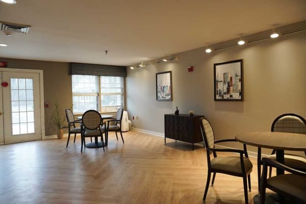 Bright interior common area with dining tables