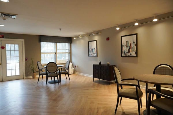 Bright interior common area with dining tables