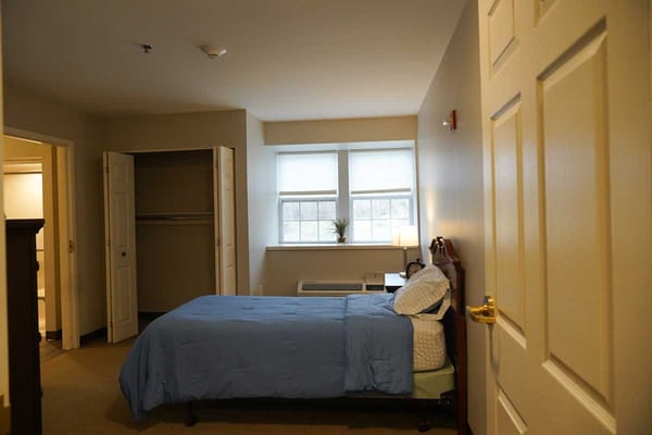 A well-furnished private resident room with natural light
