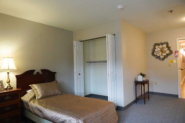 Private resident room with a bed and decor