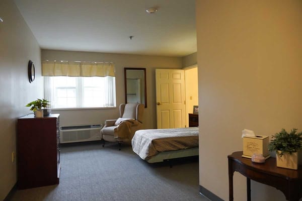 A cozy interior view of a resident bedroom