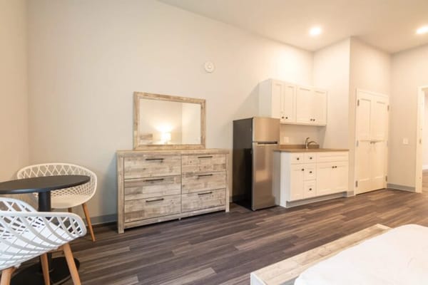Interior view of a private resident room with kitchenette