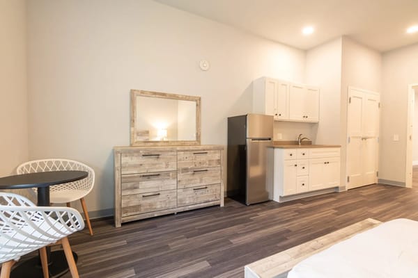 Interior view of a private resident room with kitchenette