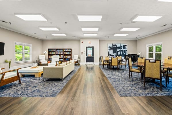 Bright common area with seating and bookshelves