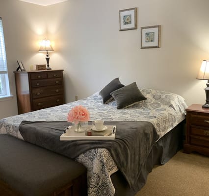 Cozy private room with a bed and decorative elements