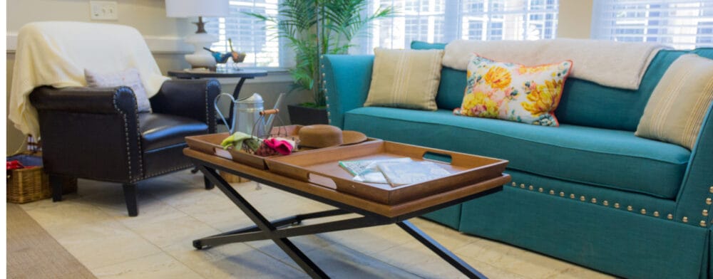 Cozy living room area with a blue couch and decor