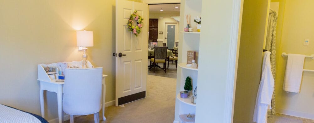 Brightly lit interior of a resident room with furnishings