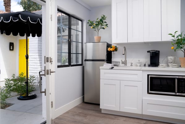 Modern kitchen area with outdoor access