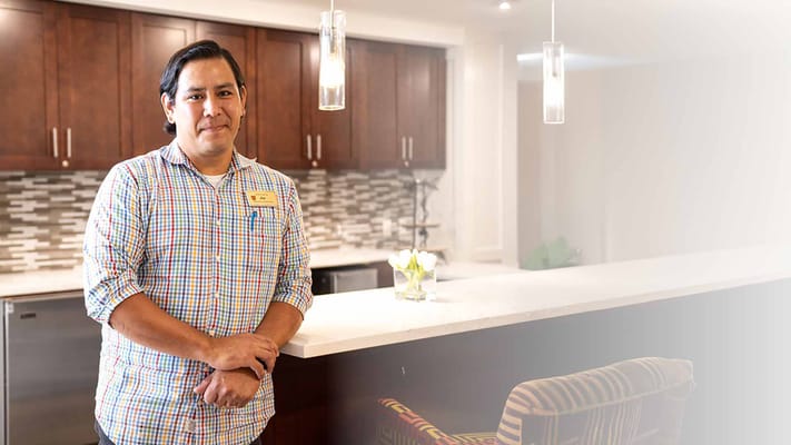 Staff member in a modern interior kitchen area