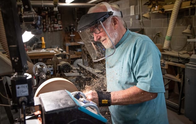 Senior man working on a woodworking project