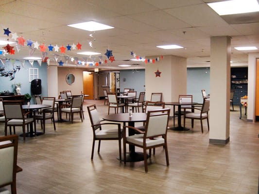 Bright dining room with tables and festive decorations