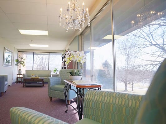 Bright common area with comfortable seating and large windows