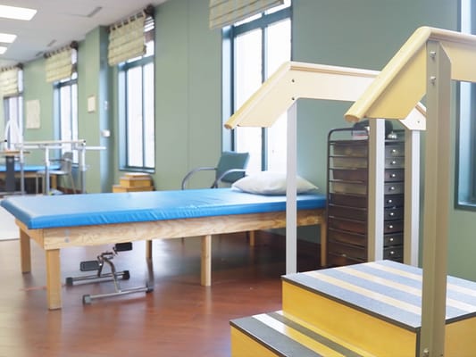 Rehabilitation area with equipment and therapy beds