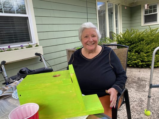 Resident engaging in an outdoor craft activity