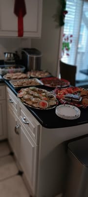 A variety of food platters arranged on a counter