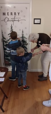 Residents and children decorating for Christmas