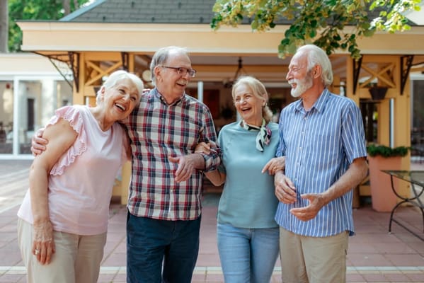 Four residents enjoying time together outside
