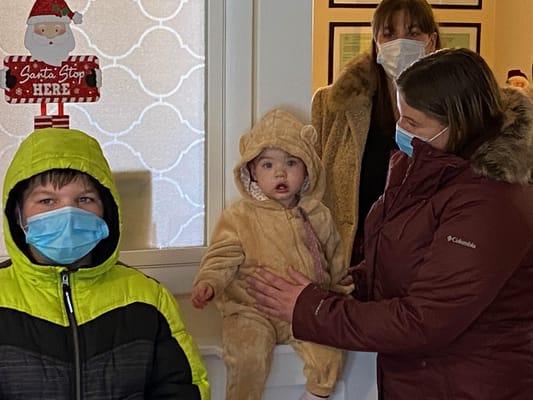 Residents and family members gathered in a cozy indoor space