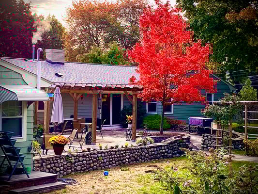 Outdoor patio area with colorful fall foliage