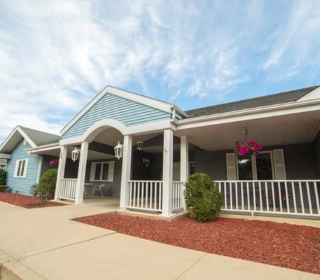 Exterior view of Harbor House Memory Care facility entrance