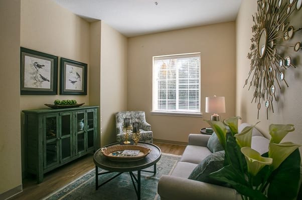 Cozy sitting area with plants and artwork