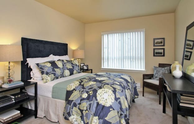 Cozy resident bedroom with floral bedding and decor