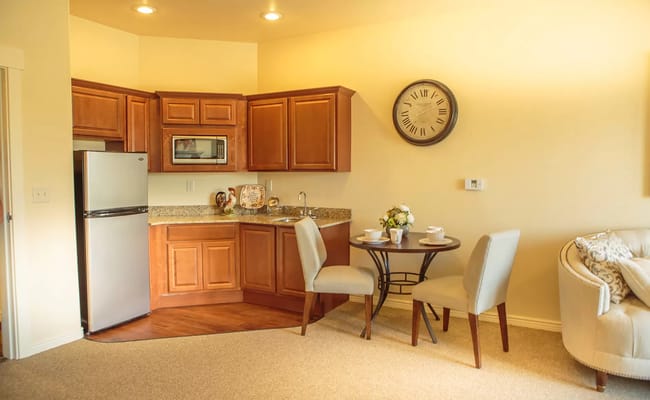 Cozy kitchenette and dining area in a resident room