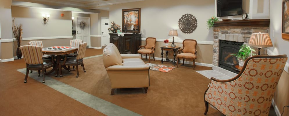 Bright common area with seating and games