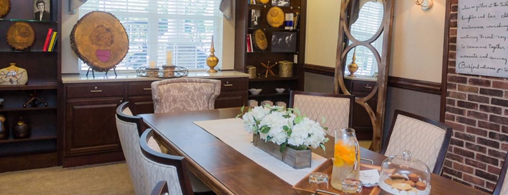 Interior view of a cozy common area with a dining table