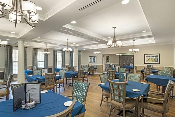 Dining area with tables set for residents