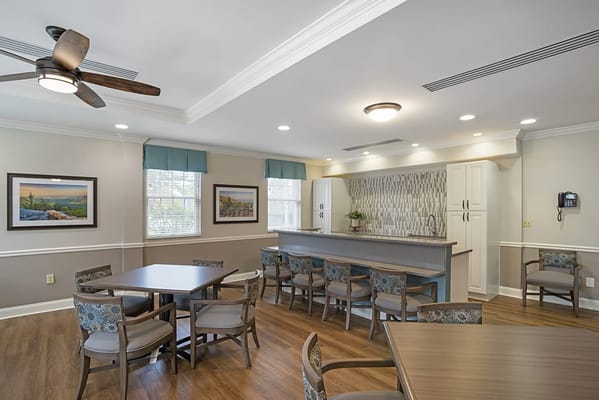 Bright common area with seating and kitchenette