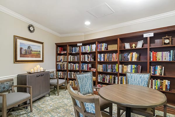 Cozy reading area with bookshelves and seating