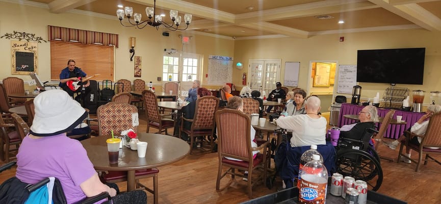 Residents enjoying live music in a common area