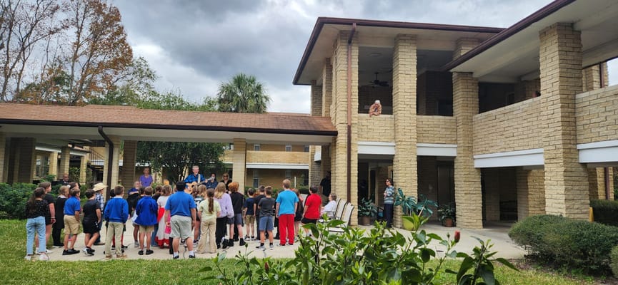 Residents and children gathered outside the building for an event