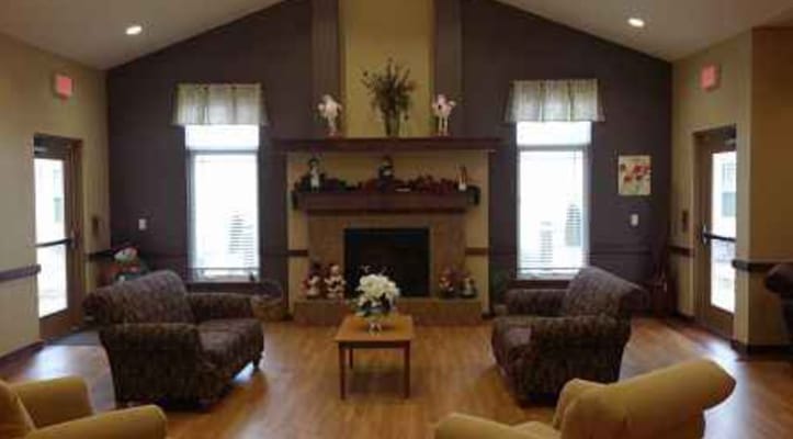 Cozy lounge area with seating and a fireplace