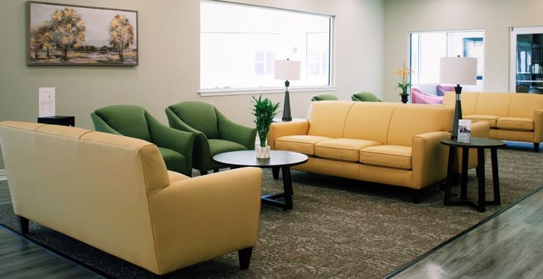 Cozy lounge area with comfortable seating and natural lighting