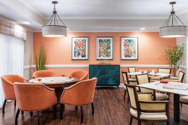 Bright common area with colorful artwork and seating