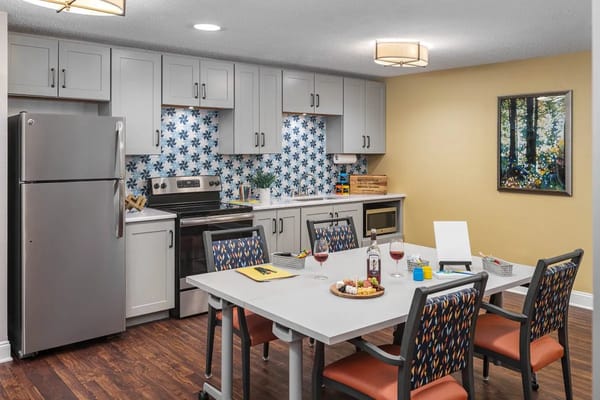 Modern kitchen with dining table and food spread