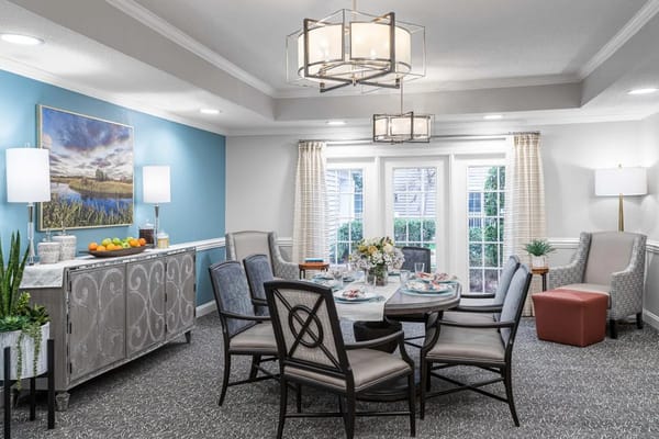 Bright dining area with round table and chairs