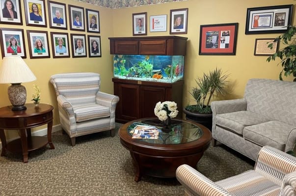 Cozy common area with seating and aquarium
